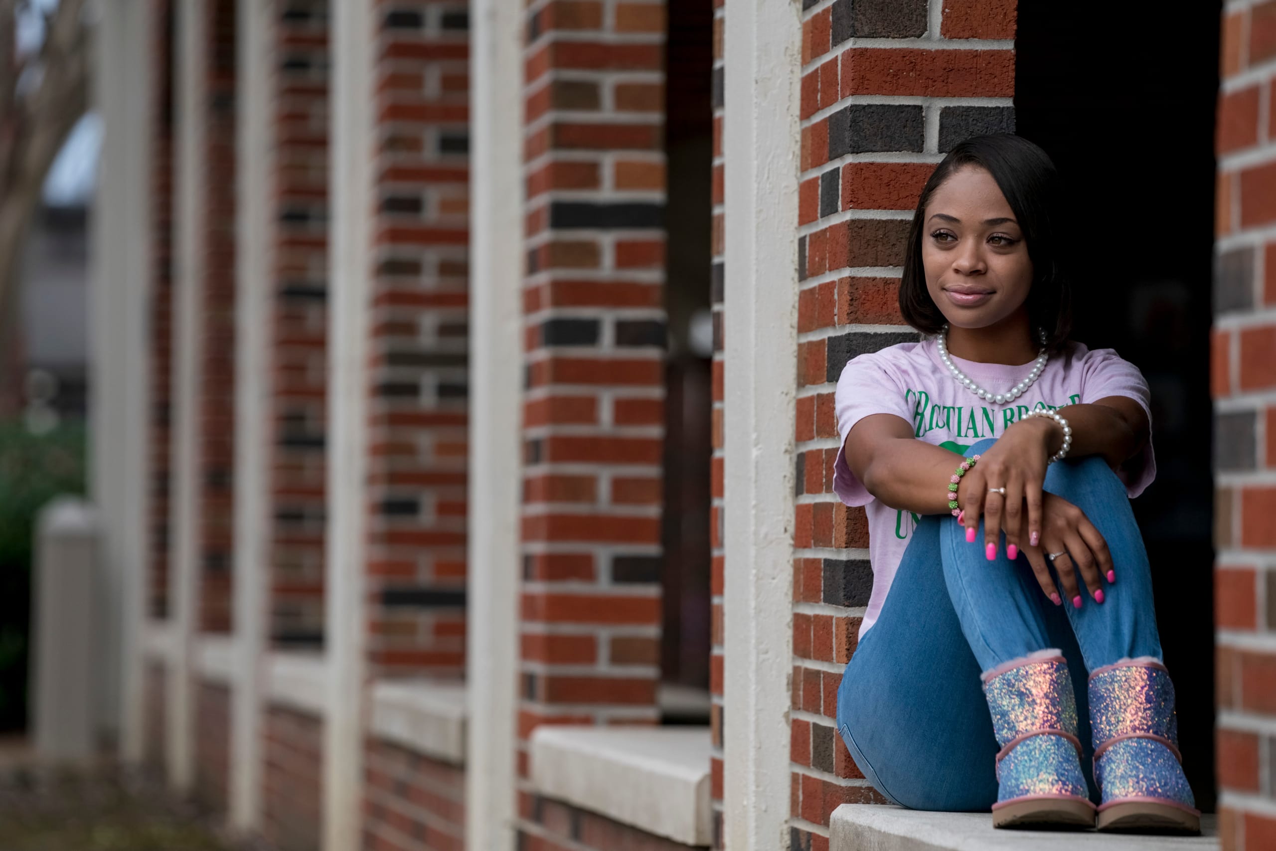 CBU Student Brooke Johnson sitting under the arches on CBU campus.